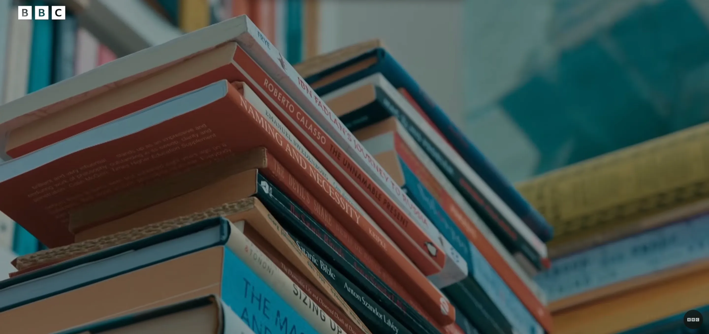 A stack of books on Knausgård’s shelf, including The Master and His Emissary